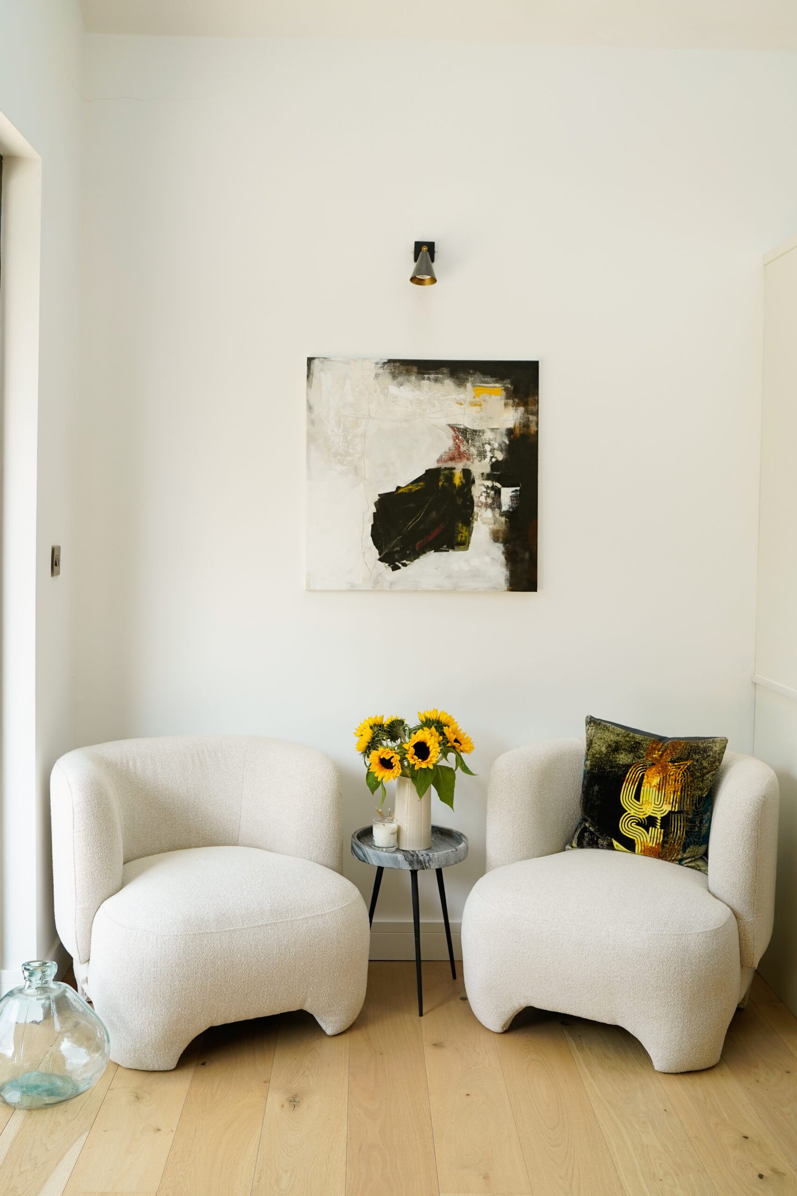 white chairs with a vase of sunflowers UGCbyKaren